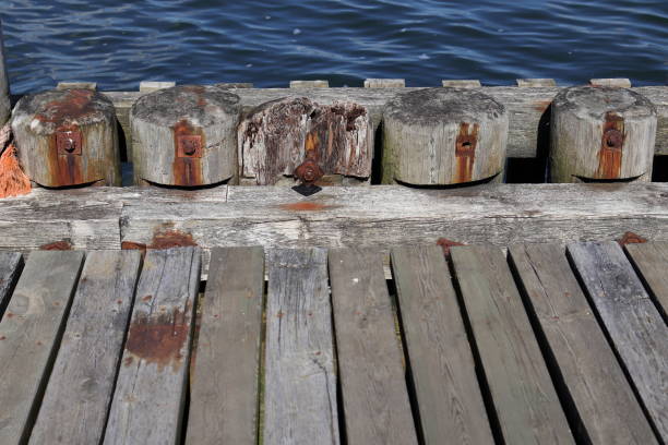 istock Rusty bolts and a wooden deck 1652545484