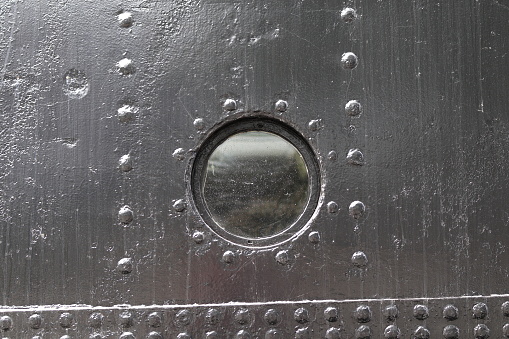 Round porthole on a black background