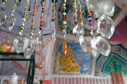 Hanging handmade decoration details for interior made of glass in mexican style. Traditional design. asian culture