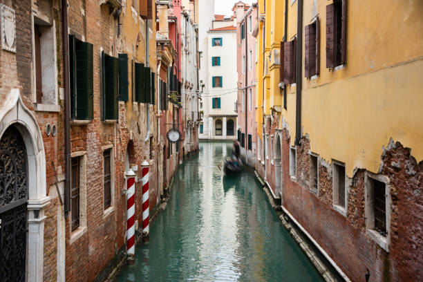 istock Narrow canal with gondolas in Venice, Italy 1652561603