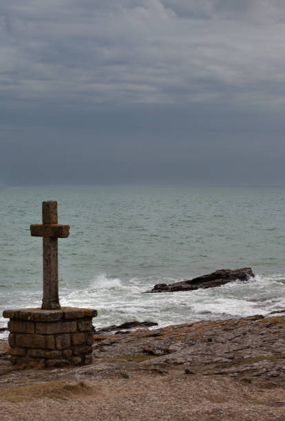 istock Maritime landscape with a granite religious cross. 1652576194