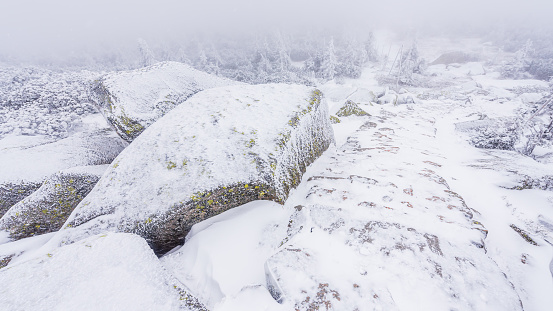 A frozen Krkonosska magistrala trail in Krkonose national park in cold winter day.