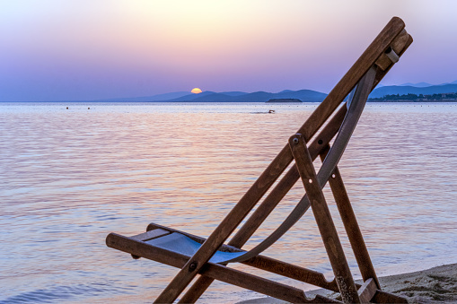 Dark blue sea and sky, and the chair