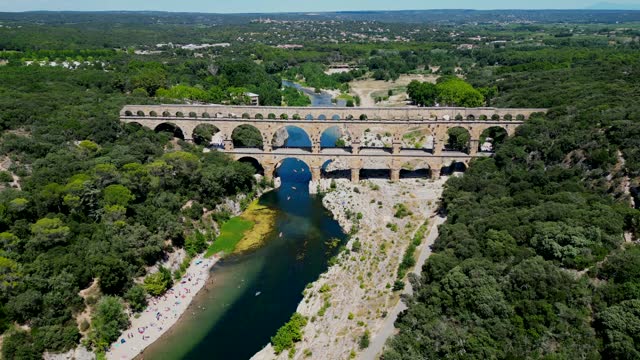 Three-tiered aqueduct Pont du Gard was built in Roman times on the river Gardon and magnificent natural park, Provence
