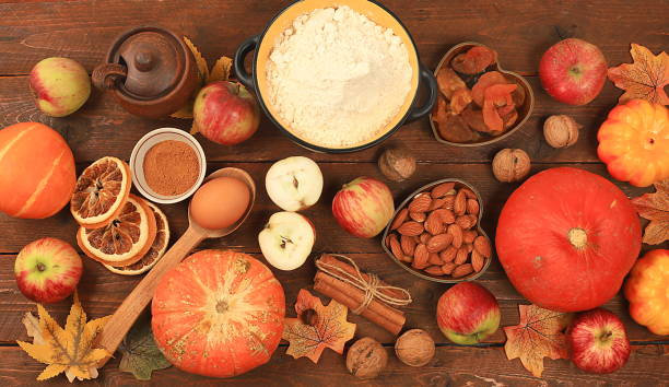istock Kitchen background with pumpkin, apples, spices, nuts, flour, eggs, food preparation concept, ingredients for pumpkin and apple pies recipe, menu for restaurant, selective focus, top view, 1652588231