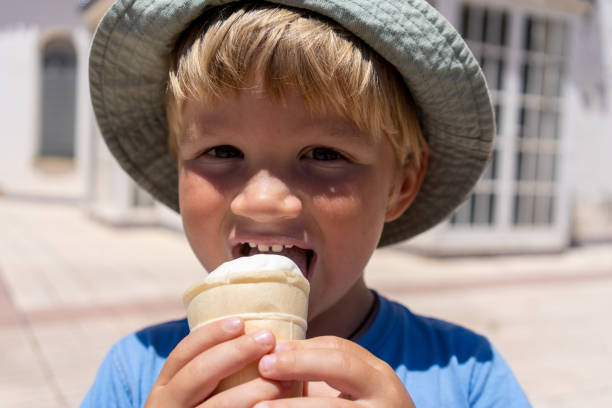 istock little boy 3 years old eats ice cream and smiles 1652611208