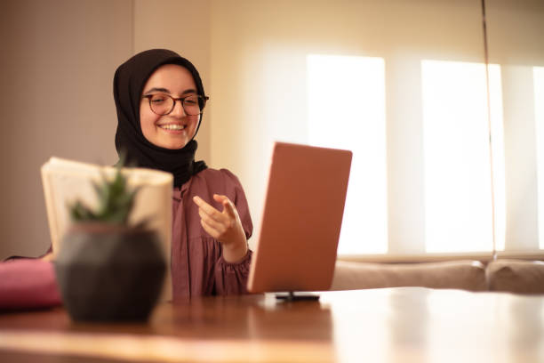 istock Hijab woman accessing having a video call with a professional on digital tablet. 1652657299