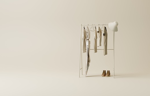 3D clothes rail with copy space.Clothes on minimal light background, shelf on cream background. Collection of clothes hanging on a rack in neutral beige colors. 3d rendering, store and bedroom concept