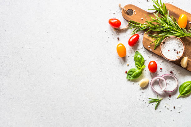 Food cooking background on white stone table.