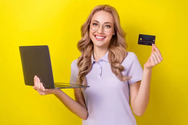 Photo of sweet adorable lady wear purple polo spectacles online shopping modern gadget isolated yellow color background.