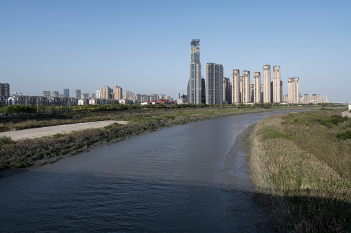 Modern urban high-rise buildings by the river