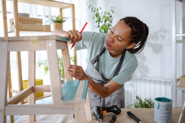 istock African American woman watching online tutorial about woodcraft 1652704473