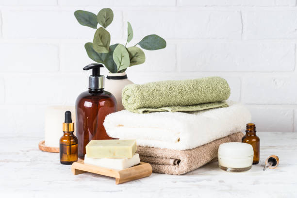 istock Stack of towels, shampoo bottle, candles, essential oil and cosmetics. 1652713441