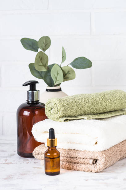 istock Stack of towels, shampoo bottle, candles, essential oil and cosmetics. 1652713447