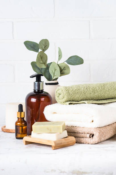 istock Stack of towels, shampoo bottle, candles, essential oil and cosmetics. 1652713961