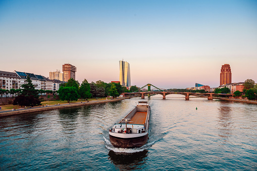 freight vessel on main river in Frankfurt at sunset