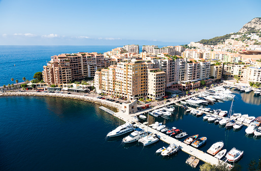 Montecarlo, Monaco - August 2022: panoramic view of the Fontvielle port with blue sky and sea