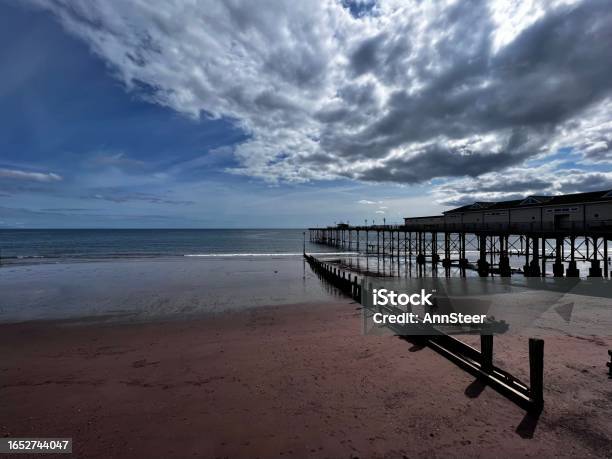Cloudy Sky Over Teignmouth Stock Photo - Download Image Now - Architecture, Bay of Water, Beach