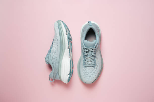 istock New female modern running shoe on pink 1652767612