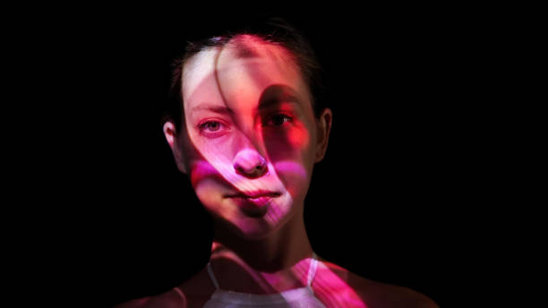 istock Colorful lights on a woman's face 1652771436