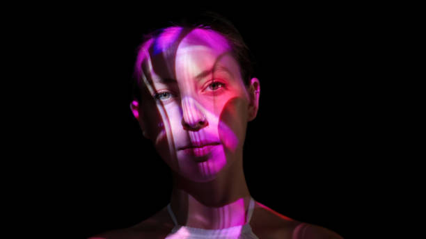istock Colorful lights on a woman's face 1652771445