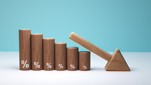 Wooden blocks with percentage sign and arrow Down Financial, interest rate concept, decrease deflation - 4K Video