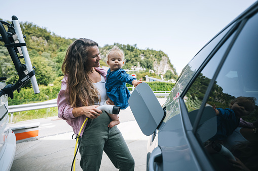 They are at an electric-vehicle charging station in the countryside