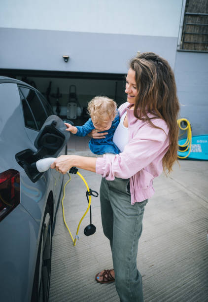 istock Mother and infant charge electric vehicle 1652783213