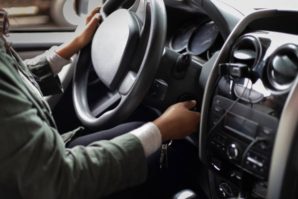 istock Woman starting a car, car interior 1652789458