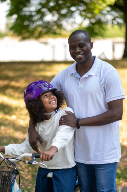 istock Father and children spending time in a park together 1652801524