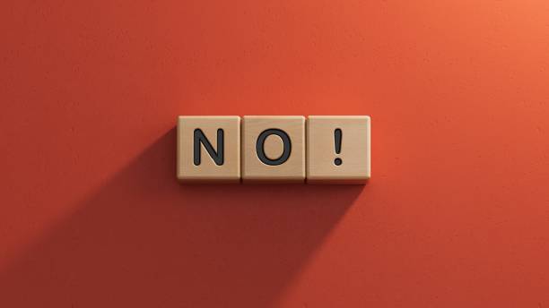 istock Wooden cubes with text no. Negative answer concept. No risk, no violence or no discrimination concept.3D rendering on red background. 1652805667