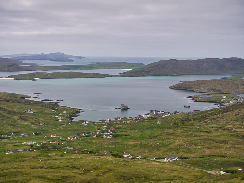 The village of Castlebay on the island of Barra in the Outer Hebrides, Scotland, UK. Taken looking southwest toward the island of Vatersay from the hill of Heaval, the highest point on Barra.