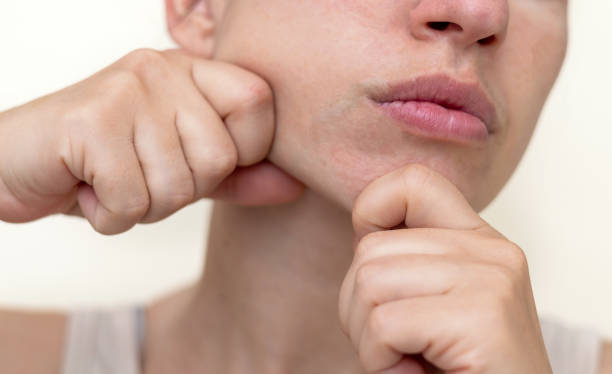 istock millennial woman practising face massage yoga exercises 1652842388