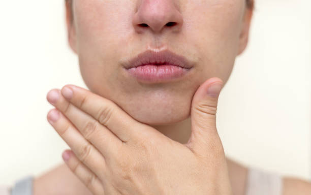 istock millennial woman practising face massage yoga exercises 1652842930