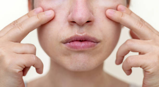 istock millennial woman practising face massage yoga exercises 1652842932