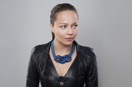 Perfect blue necklace on neck of brunette model woman
