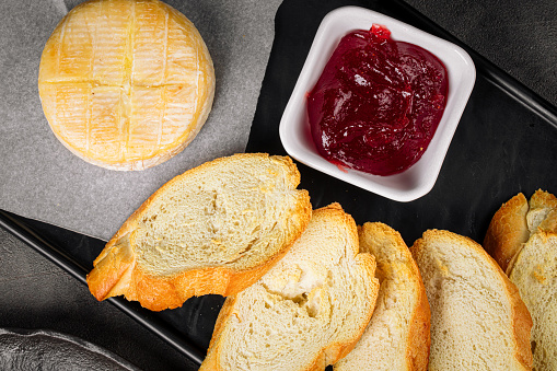 Baked camembert cheese with berry jam appetizer