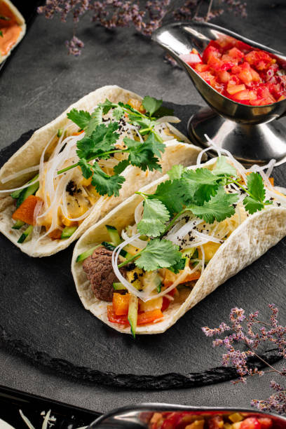 istock Tacos filled with beef meat and vegetables 1652848813