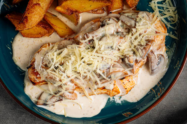 istock Grilled chicken steak with potato and creamy sauce 1652848871
