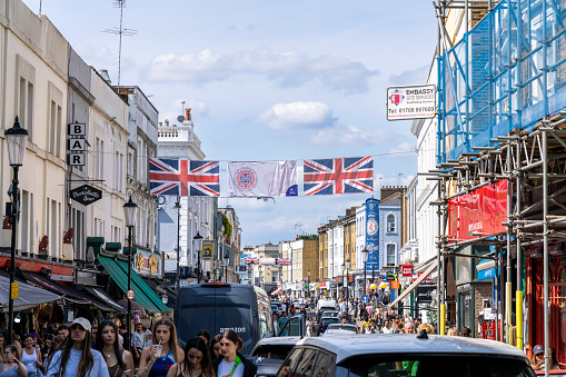 London England - May 28 2023: Crowded Portobello Road in Notting Hill in England with many Shops