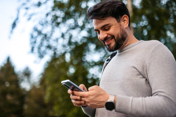 istock Man Texting On His Smartphone Outdoors 1652860184