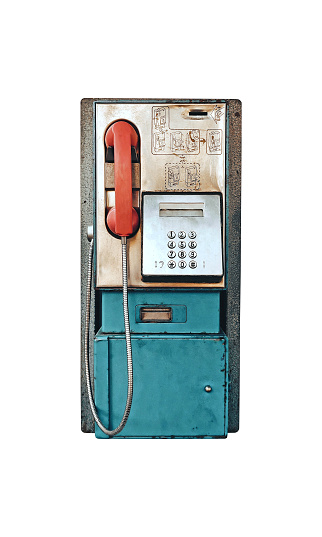 Old vintage coin operated public payphone isolated on white background, front view retro telephone