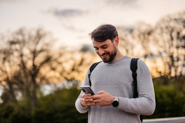 istock Man Texting On His Smartphone Outdoors 1652861856