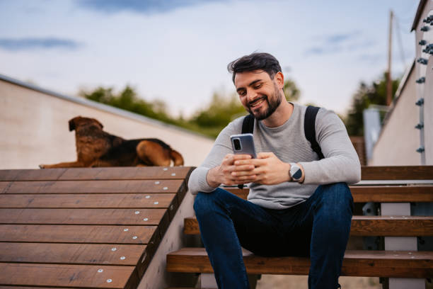 istock Man Texting On His Smartphone Outdoors 1652862372