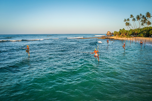 A close-up of a stilt fishermen working near Galle town, Sri Lanka, Asia. Stilt Fishing is one of the most interesting traditional fishing methods in Asia
