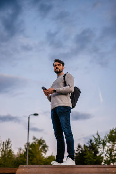 Man In The City Park On A Cloudy Spring Morning