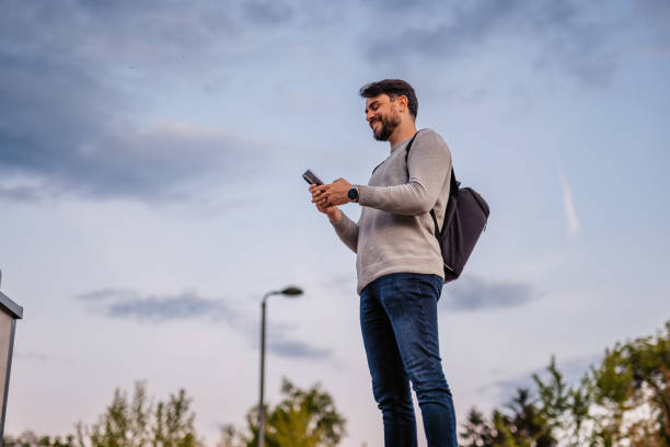 istock Man Texting On His Smartphone Outdoors 1652866096