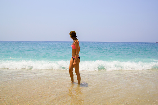 Pregnant Caucasian woman enjoying her summer vacation on the island of Levkas, Greece.