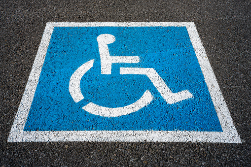 Signage identifying locations for vehicles supporting those with disabilities