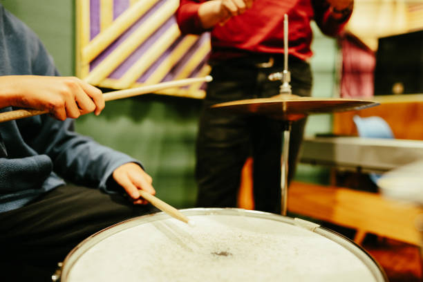 istock Close-up of child playing drum kit at a recording studio 1652935808